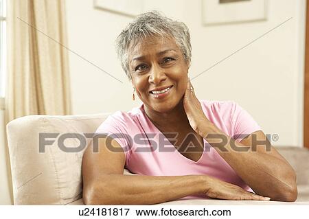 Senior Woman Relaxing In Chair At Home View Large Photo Image Stock Photo - Senior Woman Relaxing In Chair At Home. Fotosearch