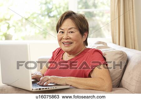 Senior Woman Using Laptop At Home View Large Photo Image Stock Image - Senior Woman Using Laptop At Home. Fotosearch