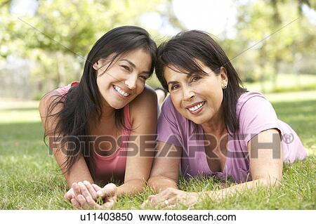 Senior Woman With Adult Daughter In Park View Large Photo Image Stock Image - Senior Woman With Adult Daughter In Park. Fotosearch
