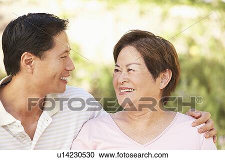 Senior Woman With Adult Son In Garden View Large Photo Image Stock Image - Senior Woman With Adult Son In Garden. Fotosearch