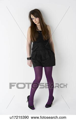 Stock Image - Studio Portrait Of Fashionably Dressed Teenage Girl. Fotosearch
