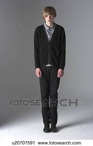 Stock Image - Studio Portrait Of Fashionably Dressed Teenage Boy. Fotosearch