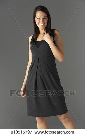 Stock Photo - Studio Portrait Of Fashionably Dressed Woman. Fotosearch