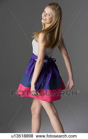 Stock Photo - Studio Portrait Of Fashionably Dressed Teenage Girl. Fotosearch