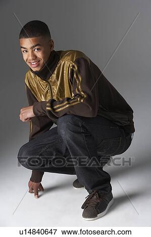 Studio Portrait Of Fashionably Dressed Teenage Boy View Large Photo Image Stock Photo - Studio Portrait Of Fashionably Dressed Teenage Boy. Fotosearch