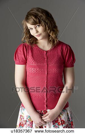 Stock Photo - Studio Portrait Of Fashionably Dressed Teenage Girl. Fotosearch