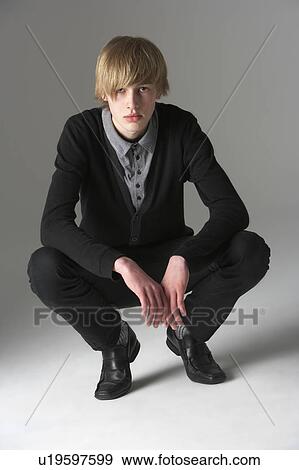 Studio Portrait Of Fashionably Dressed Teenage Boy View Large Photo Image Stock Photo - Studio Portrait Of Fashionably Dressed Teenage Boy. Fotosearch