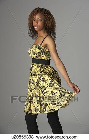 Stock Photo - Studio Portrait Of Fashionably Dressed Teenage Girl. Fotosearch