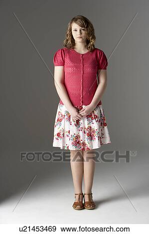 Stock Photo - Studio Portrait Of Fashionably Dressed Teenage Girl. Fotosearch