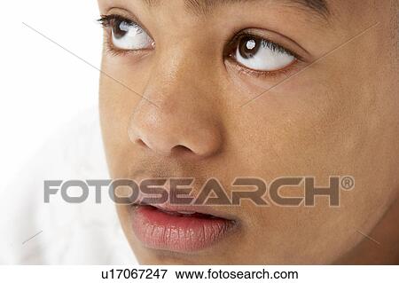 Stock Photo - Studio Portrait Of Serious Teenage Boy. Fotosearch