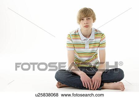 Stock Photo - Studio Portrait Of Serious Teenage Boy. Fotosearch
