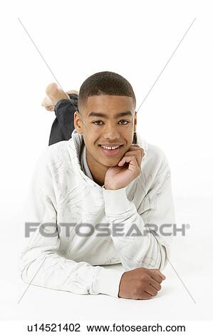 Stock Image - Studio Portrait Of Smiling Teenage Boy. Fotosearch