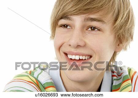 Studio Portrait Of Smiling Teenage Boy View Large Photo Image Stock Image - Studio Portrait Of Smiling Teenage Boy. Fotosearch