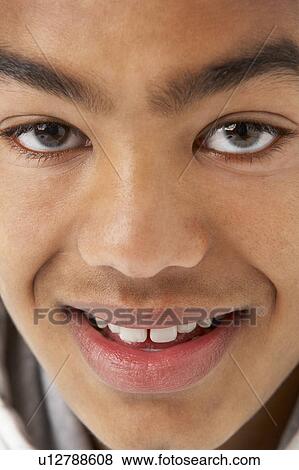 Studio Portrait Of Smiling Teenage Boy View Large Photo Image Stock Photo - Studio Portrait Of Smiling Teenage Boy. Fotosearch