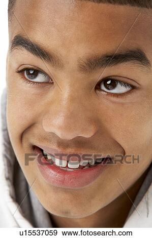 Studio Portrait Of Smiling Teenage Boy View Large Photo Image Stock Photo - Studio Portrait Of Smiling Teenage Boy. Fotosearch