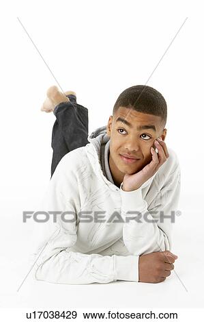 Stock Photo - Studio Portrait Of Smiling Teenage Boy. Fotosearch