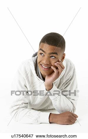 Studio Portrait Of Smiling Teenage Boy View Large Photo Image Stock Photo - Studio Portrait Of Smiling Teenage Boy. Fotosearch