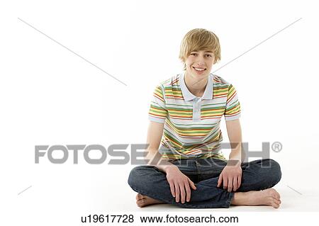 Stock Photo - Studio Portrait Of Smiling Teenage Boy. Fotosearch