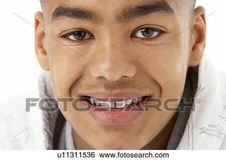 Studio Portrait Of Smiling Teenage Boy View Large Photo Image Stock Photograph - Studio Portrait Of Smiling Teenage Boy. Fotosearch
