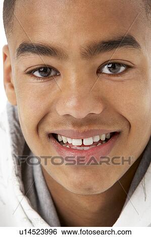 Studio Portrait Of Smiling Teenage Boy View Large Photo Image Stock Photograph - Studio Portrait Of Smiling Teenage Boy. Fotosearch