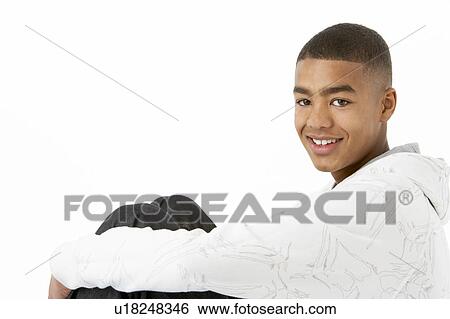 Studio Portrait Of Smiling Teenage Boy View Large Photo Image Stock Photograph - Studio Portrait Of Smiling Teenage Boy. Fotosearch