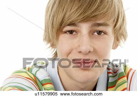 Stock Photography - Studio Portrait Of Smiling Teenage Boy. Fotosearch
