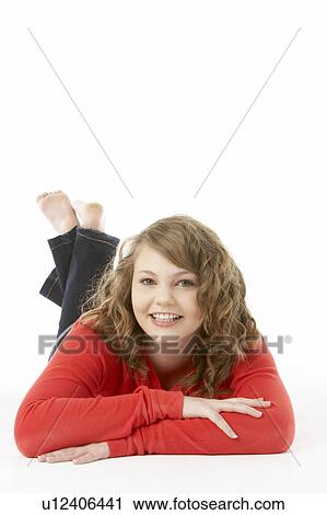 Stock Image - Studio Portrait Of Smiling Teenage Girl. Fotosearch