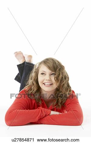 Stock Image - Studio Portrait Of Smiling Teenage Girl. Fotosearch