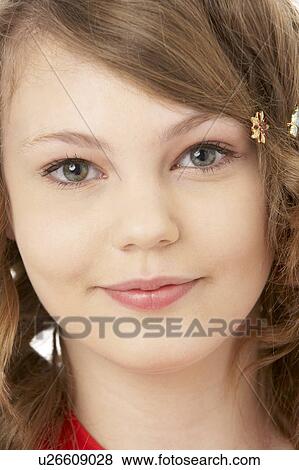 Stock Photo - Studio Portrait Of Smiling Teenage Girl. Fotosearch