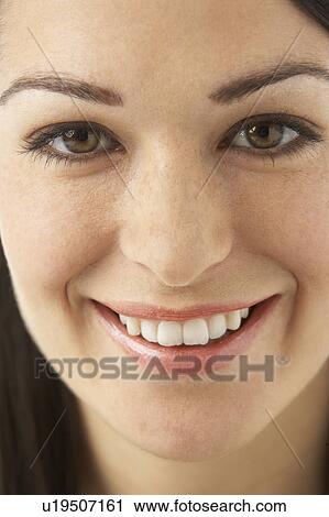 Stock Image - Studio Portrait Of Smiling Woman. Fotosearch