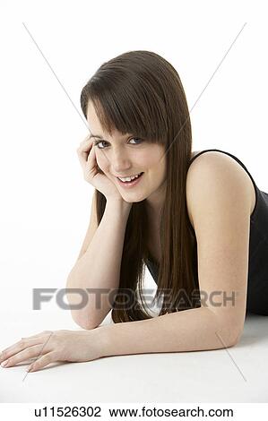 Stock Image - Studio Portrait Of Teenage Girl On White Background. Fotosearch