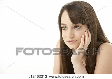 Stock Image - Studio Portrait Of Teenage Girl On White Background. Fotosearch