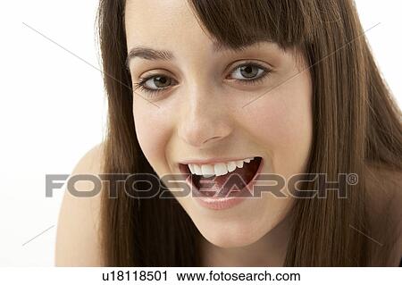Stock Image - Studio Portrait Of Teenage Girl On White Background. Fotosearch