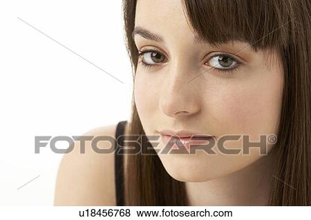 Stock Photo - Studio Portrait Of Teenage Girl On White Background. Fotosearch