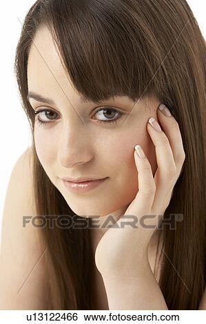 Stock Photograph - Studio Portrait Of Teenage Girl On White Background. Fotosearch