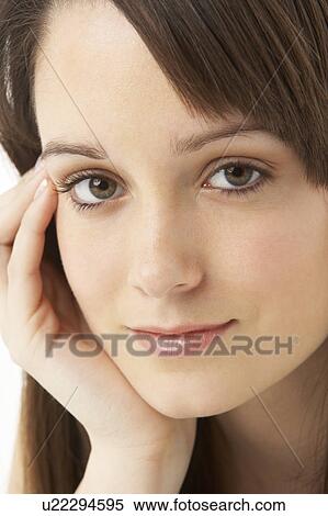 Stock Photography - Studio Portrait Of Teenage Girl On White Background. Fotosearch