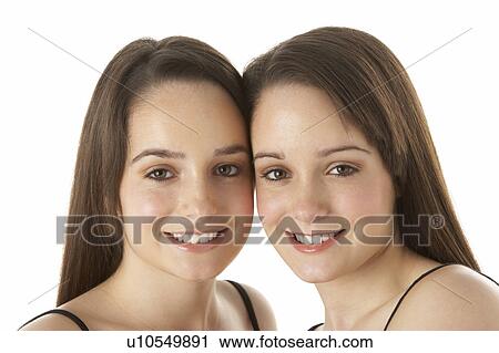 Studio Portrait Of Teenage Twins View Large Photo Image Stock Image - Studio Portrait Of Teenage Twins. Fotosearch