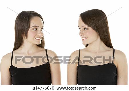 Studio Portrait Of Teenage Twins View Large Photo Image Stock Image - Studio Portrait Of Teenage Twins. Fotosearch