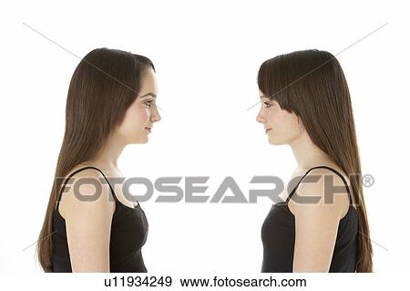 Studio Portrait Of Teenage Twins View Large Photo Image Stock Photo - Studio Portrait Of Teenage Twins. Fotosearch