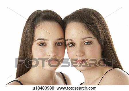 Studio Portrait Of Teenage Twins View Large Photo Image Stock Photo - Studio Portrait Of Teenage Twins. Fotosearch