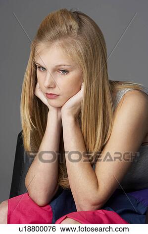Studio Portrait Of Unhappy Teenage Girl View Large Photo Image Stock Photograph - Studio Portrait Of Unhappy Teenage Girl. Fotosearch