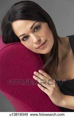 Studio Portrait Of Woman Relaxing On Pink Chaise Longue View Large Photo Image Stock Photo - Studio Portrait Of Woman Relaxing On Pink Chaise Longue. Fotosearch