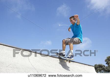 Teenage Boy In Skateboard Park View Large Photo Image Stock Image - Teenage Boy In Skateboard Park. Fotosearch