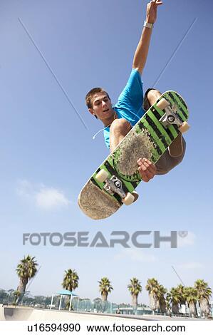 Teenage Boy In Skateboard Park View Large Photo Image Stock Image - Teenage Boy In Skateboard Park. Fotosearch
