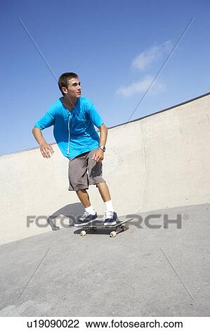 Teenage Boy In Skateboard Park View Large Photo Image Stock Image - Teenage Boy In Skateboard Park. Fotosearch