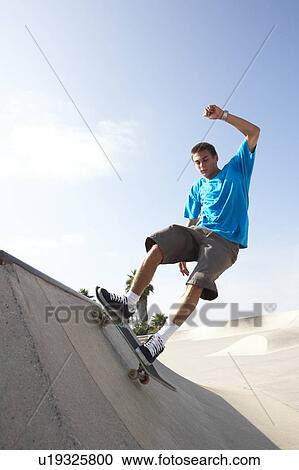 Teenage Boy In Skateboard Park View Large Photo Image Stock Image - Teenage Boy In Skateboard Park. Fotosearch
