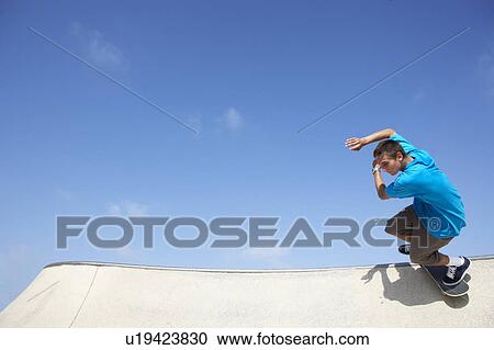 Teenage Boy In Skateboard Park View Large Photo Image Stock Image - Teenage Boy In Skateboard Park. Fotosearch