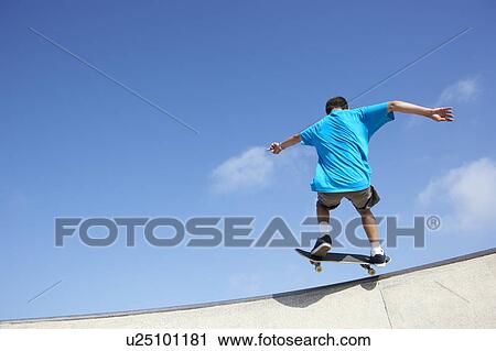 Stock Image - Teenage Boy In Skateboard Park. Fotosearch