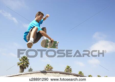 Teenage Boy In Skateboard Park View Large Photo Image Stock Image - Teenage Boy In Skateboard Park. Fotosearch