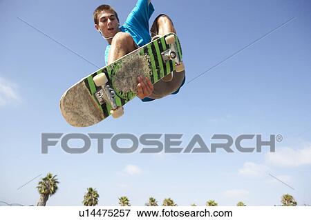 Teenage Boy In Skateboard Park View Large Photo Image Stock Photo - Teenage Boy In Skateboard Park. Fotosearch